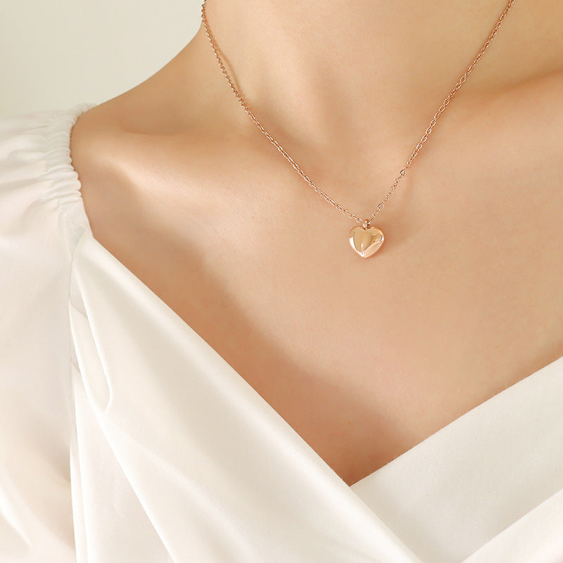 Model wearing the rose gold heart pendant necklace