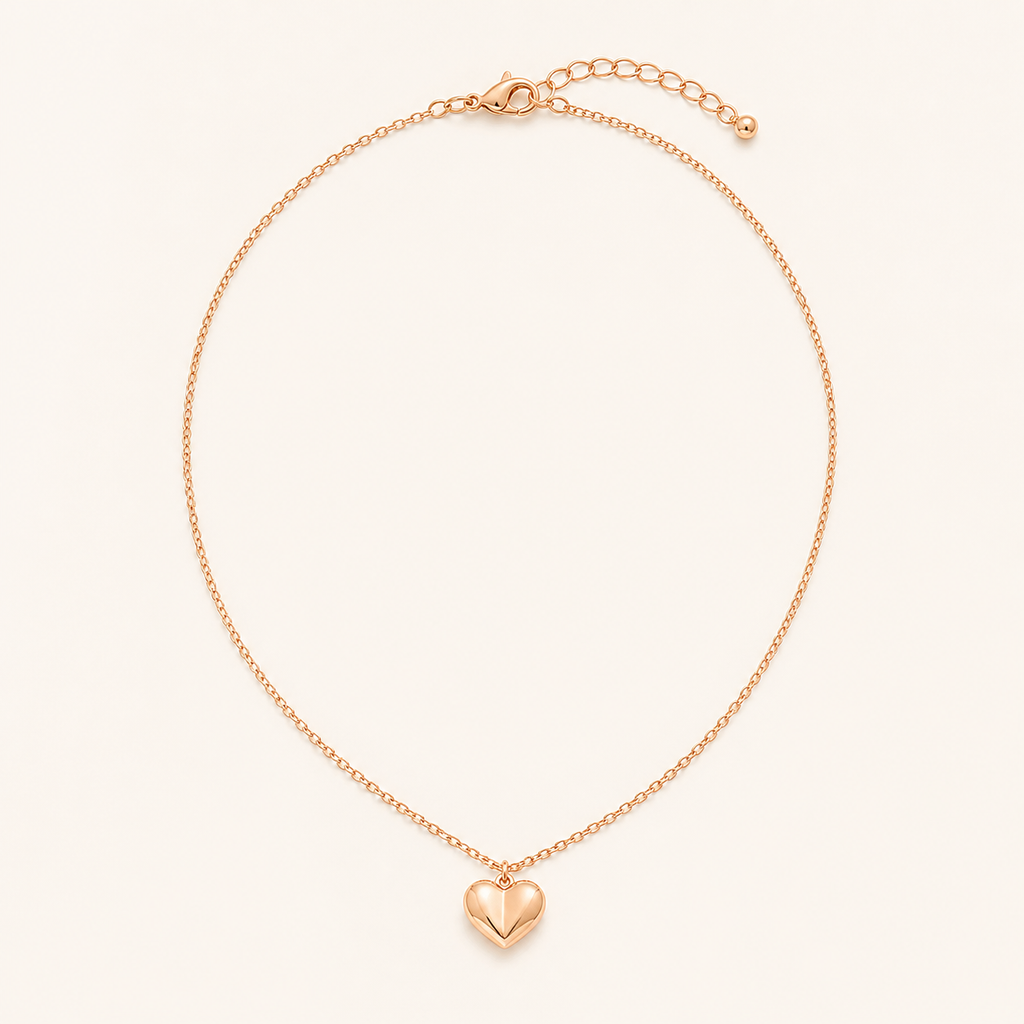 Rose gold heart pendant necklace on a warm cream background