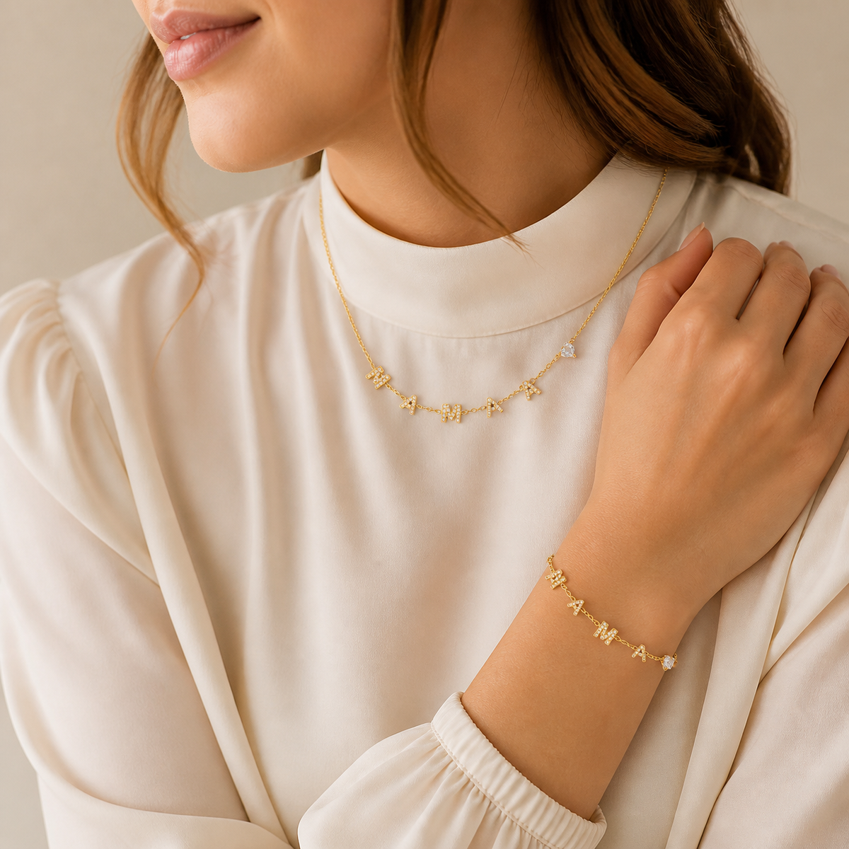 Model wearing the matching gold MAMA heart zircon necklace and bracelet