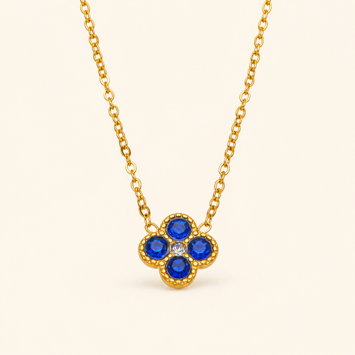 Clover of Grace sapphire blue zircon necklace in gold