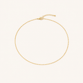 Gold Thin Starlight Chain fully visible on warm ivory background