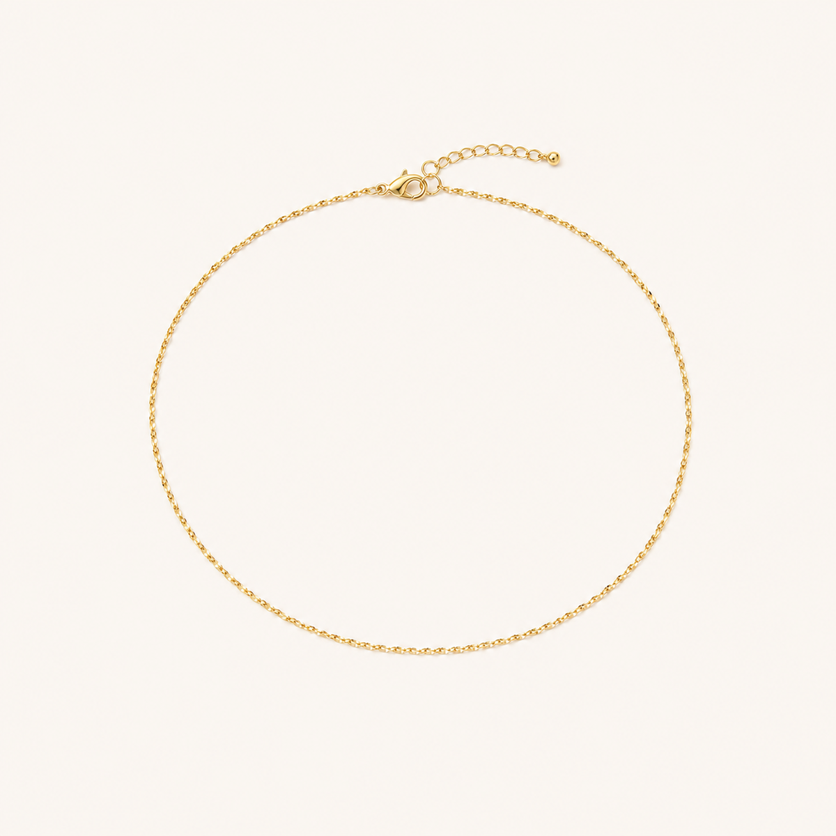 Gold Thin Starlight Chain fully visible on warm ivory background