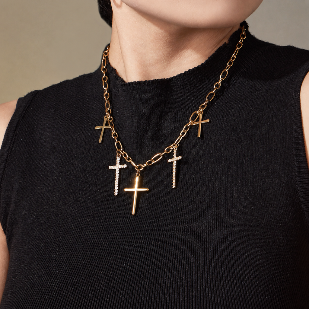Vintage Five Cross Necklace in 18K gold PVD worn on a black top